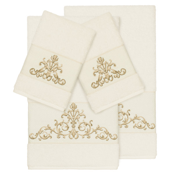 White towels with online silver trim